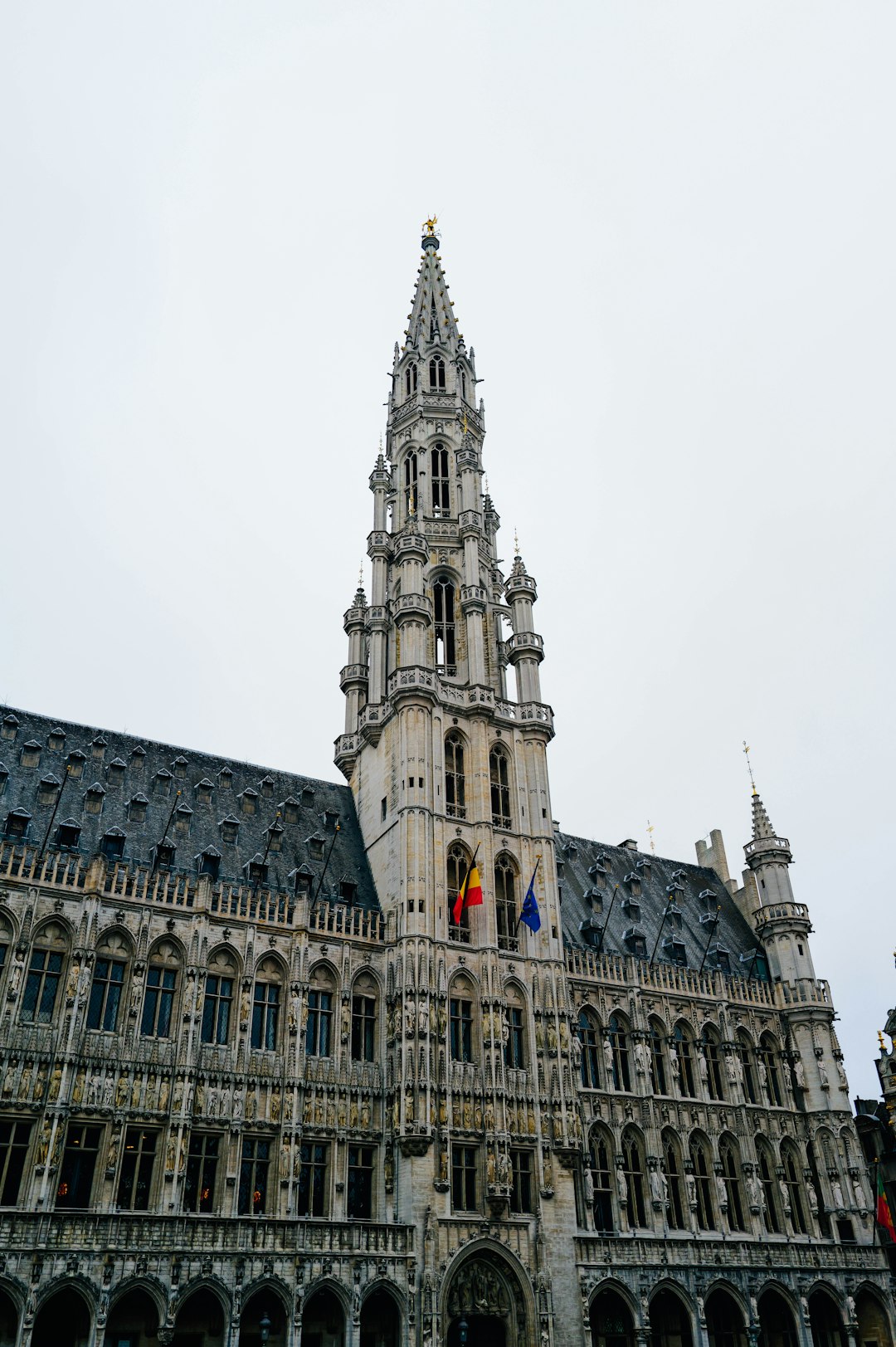 A very tall building with a clock on it's side