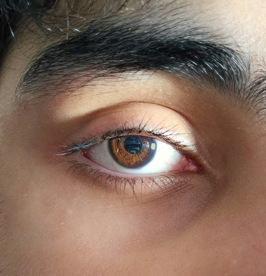 Close-up photo of a brown human eye.